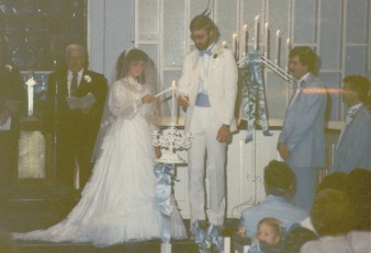 Terri and Tim Palmquist light the Unity Candle during their wedding
